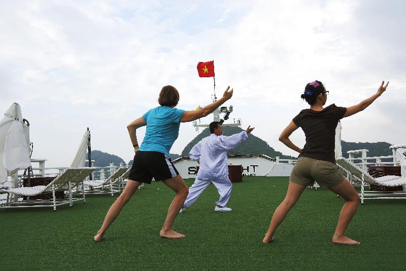Tai Chi exercise on starlight halong bay Cruises
